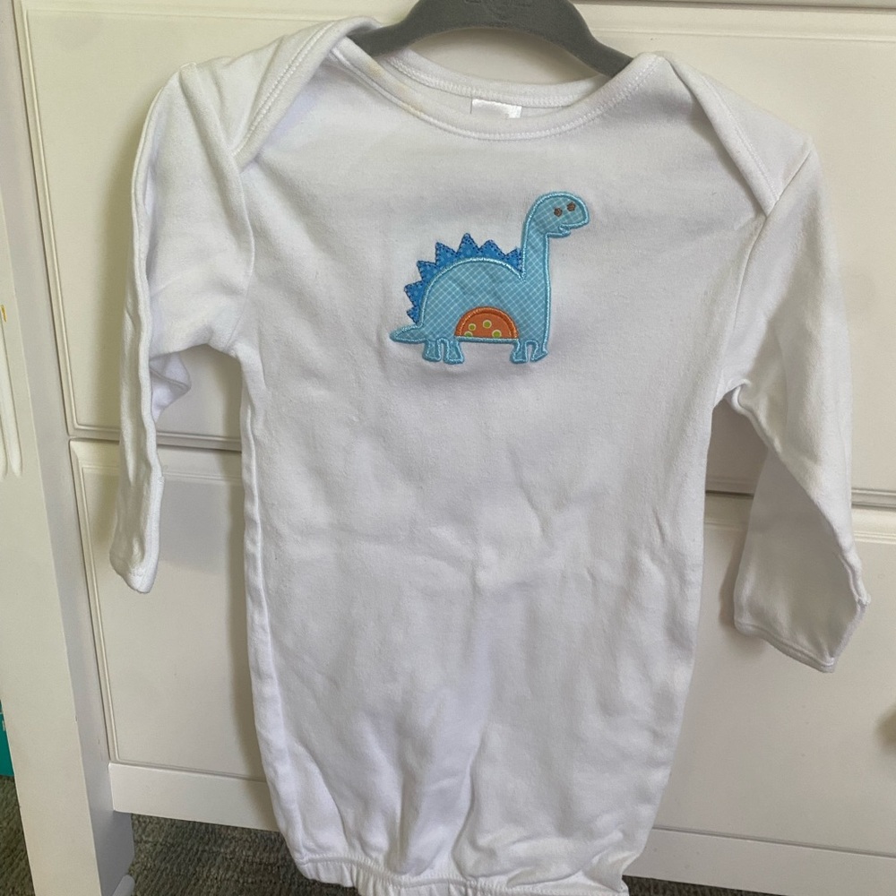 White Baby Onesie with Blue Dinosaur Design